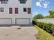 Townhouse exterior with brick accents over garage door at 946 Highland Ave # 24, Dunedin, FL 34698