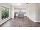 Spacious open-concept living space and modern kitchen with bright lighting at 946 Highland Ave # 24, Dunedin, FL 34698