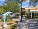 Inviting street view with public art, lush greenery, and a variety of shops and restaurants at 946 Highland Ave # 24, Dunedin, FL 34698