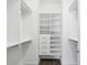 Custom walk-in closet with adjustable shelving, drawers, and hanging rods for ample storage at 946 Highland Ave # 24, Dunedin, FL 34698