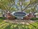 Welcoming entrance to Downtown Dunedin, spring training home, framed by trees and manicured landscaping at 946 Highland Ave # 24, Dunedin, FL 34698