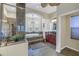 Spacious bathroom featuring a glass shower and large soaking tub with natural light from the arched windows at 9818 Tree Tops Lake Rd, Tampa, FL 33626