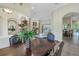 Open dining area with modern decor, views to the living room and backyard at 9818 Tree Tops Lake Rd, Tampa, FL 33626