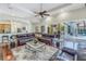 Open living area with hardwood floors and access to the lanai and pool at 9818 Tree Tops Lake Rd, Tampa, FL 33626