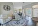 Inviting living space with arched doorways, front door view, and stylish furniture at 9818 Tree Tops Lake Rd, Tampa, FL 33626