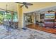 Expansive outdoor area with a bar, fireplace, and comfortable seating at 9818 Tree Tops Lake Rd, Tampa, FL 33626
