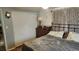 This bedroom features a large closet and an iron bed frame at 9926 Gray Fox Ln, Port Richey, FL 34668