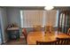 Inviting dining room with wood table set, ample lighting, and stylish decor at 9926 Gray Fox Ln, Port Richey, FL 34668
