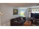 Cozy living room with comfortable seating and stylish decor at 9926 Gray Fox Ln, Port Richey, FL 34668