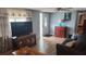 A welcoming living room with natural light, wood-look floors, and tasteful furnishings at 9926 Gray Fox Ln, Port Richey, FL 34668