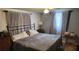 Serene main bedroom with soft lighting, a ceiling fan, and neutral decor at 9926 Gray Fox Ln, Port Richey, FL 34668