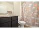 Bathroom featuring modern fixtures, a decorative shower curtain, and granite countertop at 9960 Hound Chase Dr, Gibsonton, FL 33534