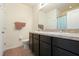 Bathroom featuring a double vanity, granite countertop, and modern fixtures at 9960 Hound Chase Dr, Gibsonton, FL 33534