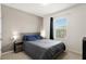 Bedroom with a window, neutral walls, and a comfortable bed with a grey headboard at 9960 Hound Chase Dr, Gibsonton, FL 33534