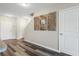 Entryway featuring durable flooring and a decorative art piece, leading to stairs and other rooms at 9960 Hound Chase Dr, Gibsonton, FL 33534