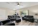 Spacious living room featuring a sliding glass door for natural light and backyard access at 9960 Hound Chase Dr, Gibsonton, FL 33534