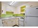 Functional kitchen with vintage appliances, ample cabinet space, and lots of potential at 10570 114Th Ter, Largo, FL 33773
