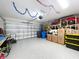 Clean, organized garage with ample storage and epoxy floor, perfect for parking and hobbies at 11013 Leland Groves Dr, Riverview, FL 33579