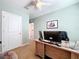Functional office space with a large desk and view to the hallway, ideal for a quiet workspace at 11013 Leland Groves Dr, Riverview, FL 33579