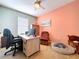 Home office with ample workspace, a comfortable chair, and soft lighting for productivity at 11013 Leland Groves Dr, Riverview, FL 33579