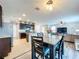 This open-concept space features a kitchen, dining area, and living room, perfect for entertaining and Gathering gatherings at 11013 Leland Groves Dr, Riverview, FL 33579