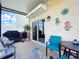 Covered patio with outdoor seating and decor, perfect for relaxing and enjoying the outdoors at 11013 Leland Groves Dr, Riverview, FL 33579