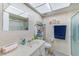 Well-lit bathroom with a shower, vanity, and tile walls at 11200 102Nd Ave # 75, Seminole, FL 33778