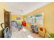 Sunlit bonus room with yellow walls, a ceiling fan, and tile floors at 11200 102Nd Ave # 75, Seminole, FL 33778
