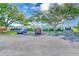 Charming exterior featuring well maintained landscaping, covered entrances, and dedicated parking at 11200 102Nd Ave # 75, Seminole, FL 33778