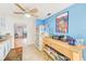 Bright kitchen with light blue walls, tile floors, and a ceiling fan at 11200 102Nd Ave # 75, Seminole, FL 33778