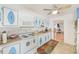 Functional kitchen with ample cabinet space and white appliances, ready for culinary adventures at 11200 102Nd Ave # 75, Seminole, FL 33778