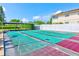 Community shuffleboard courts with green and purple flooring under a blue sky at 11200 102Nd Ave # 75, Seminole, FL 33778