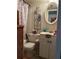 Cozy bathroom with a flamingo-themed shower curtain and vintage vanity at 11201 122Nd Ave # 129, Largo, FL 33778