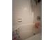 Small bathroom with a white tiled shower and a grab bar for safety at 11201 122Nd Ave # 129, Largo, FL 33778