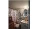 This bathroom has a vanity and mirror combo, offering style and practical storage space at 11201 122Nd Ave # 129, Largo, FL 33778