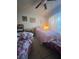 Bedroom with a ceiling fan and two twin beds, providing a comfortable and functional space at 11201 122Nd Ave # 129, Largo, FL 33778