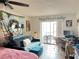 Bright living room featuring tiled floors and sliding glass doors that open to the lanai at 11201 122Nd Ave # 129, Largo, FL 33778