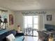 Bright living room featuring tiled floors and sliding glass doors that open to the lanai at 11201 122Nd Ave # 129, Largo, FL 33778