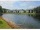 Picturesque pond surrounded by lush landscaping and charming community buildings at 11201 122Nd Ave # 129, Largo, FL 33778