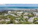 Aerial view of a community with lush green trees near the bay and waterway at 11440 Harbor Way # 5009, Largo, FL 33774