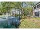 Waterfront backyard features a lush lawn, patio seating and view of the lake at 11440 Harbor Way # 5009, Largo, FL 33774