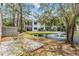 Relaxing backyard view with a pond and fountain near the outdoor patio seating at 11440 Harbor Way # 5009, Largo, FL 33774