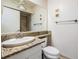 Bathroom with granite counter top, large mirror, and recessed lighting at 11440 Harbor Way # 5009, Largo, FL 33774