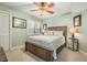 Charming bedroom with wood furniture, shuttered windows, and coastal-themed decor for a tranquil retreat at 11440 Harbor Way # 5009, Largo, FL 33774