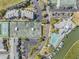 Aerial shot featuring tennis courts, a pool, boat docks, parking, and community buildings at 11440 Harbor Way # 5009, Largo, FL 33774