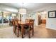 Inviting dining area featuring a wooden table with seating and a large mirror at 11440 Harbor Way # 5009, Largo, FL 33774