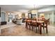 Spacious dining area with a large table, seating for six, and mirrored wall accents at 11440 Harbor Way # 5009, Largo, FL 33774