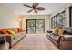 Spacious living room featuring comfortable seating, tile flooring, and a sliding door to the backyard at 11440 Harbor Way # 5009, Largo, FL 33774