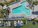 Aerial shot showcasing a pool next to boat docks, with boats and lounge chairs nearby at 11440 Harbor Way # 5009, Largo, FL 33774