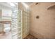 Tiled shower with glass block partition, a shower head and a built-in shower caddy to organize your accessories at 11440 Harbor Way # 5009, Largo, FL 33774